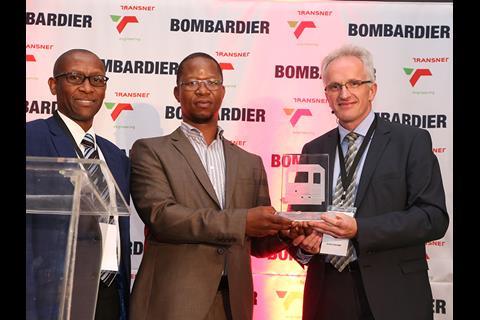 Bombardier Transportation SA Managing Director Aubrey Lekwane, Transnet Engineering CEO Thamsanqa Jiyane and Traxx Africa Project Director Henk Ekkelenkamp celebrate the handover.